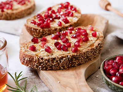 Tahini Pomegranate Toasts with Rosemary Honey